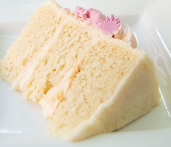 A Quinceanera themed dessert, featuring a piece of cake on a white plate