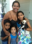 Itzel and her family with Pelon.