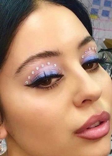 Maddy Perez, a close up of a person with Quinceanera makeup